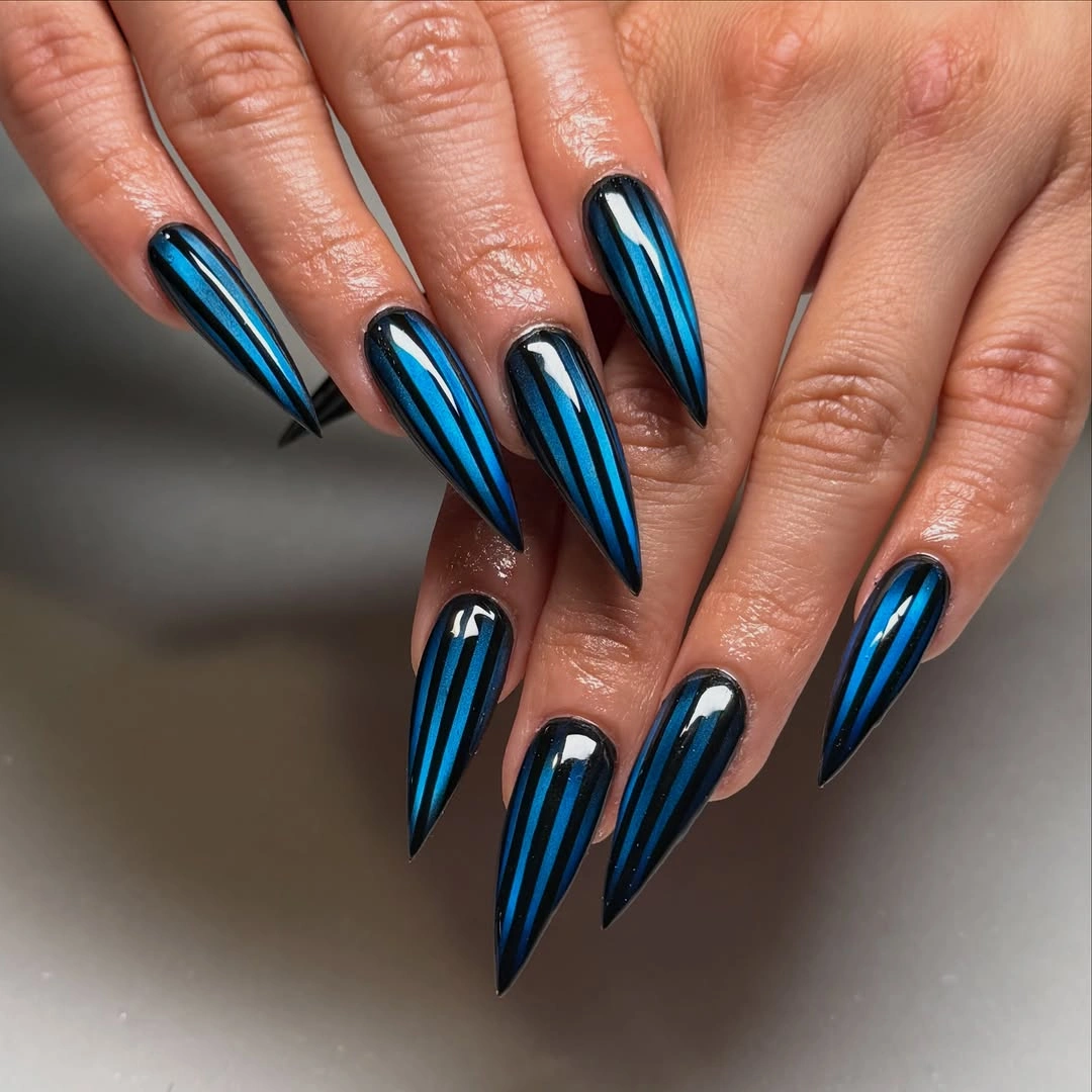 Electric blue chrome stiletto nails with black framing details