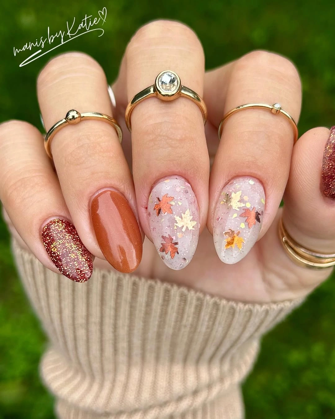 Rust pink white floral almond nails with glitter accent