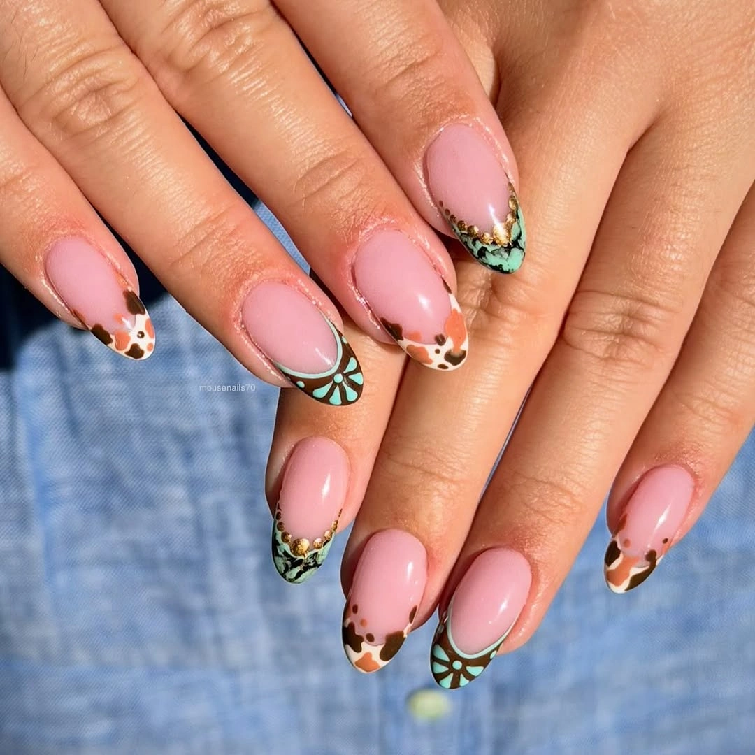 Pink almond nails with green black patterned tip details