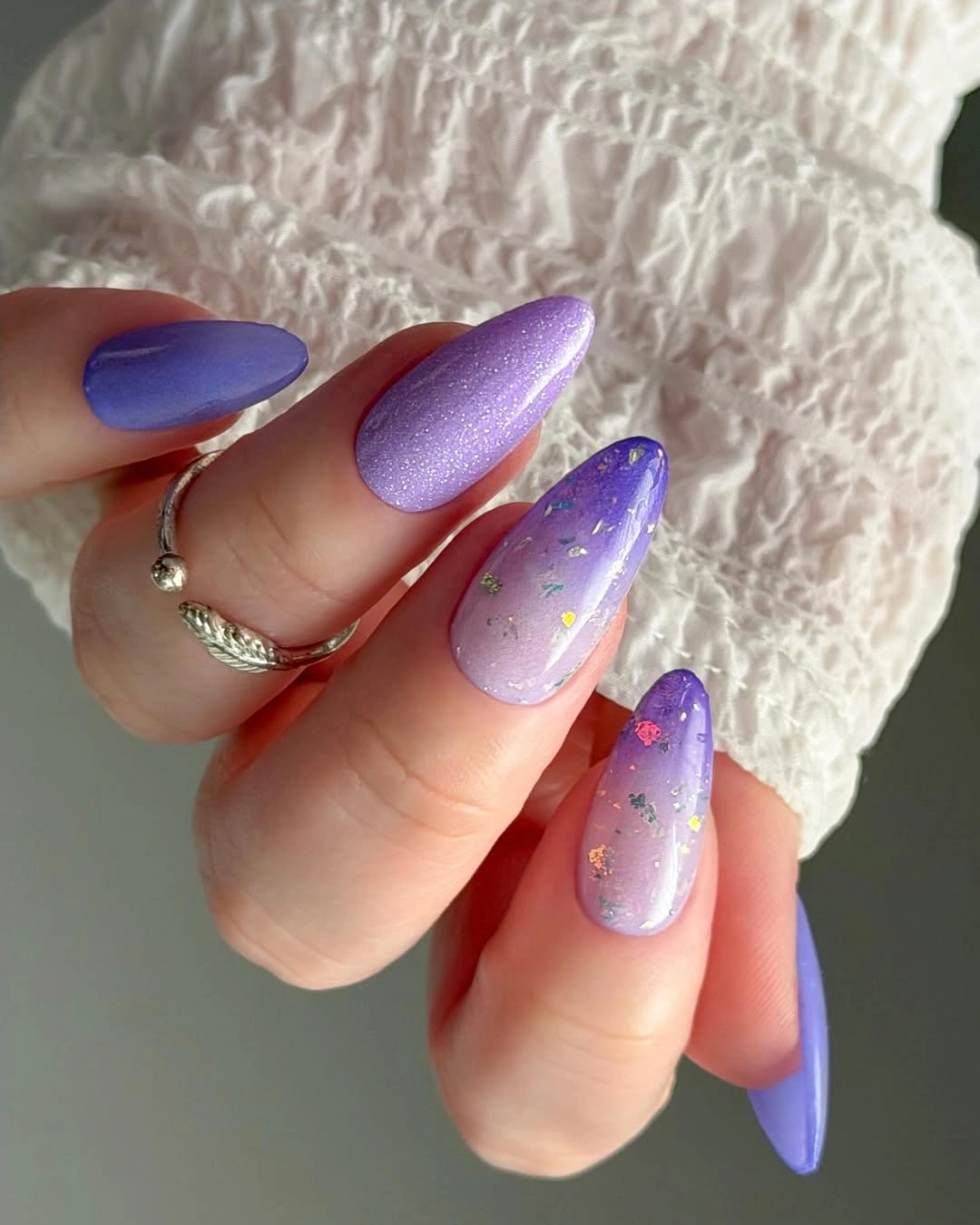Long lavender almond nails with one subtle sparkly accent