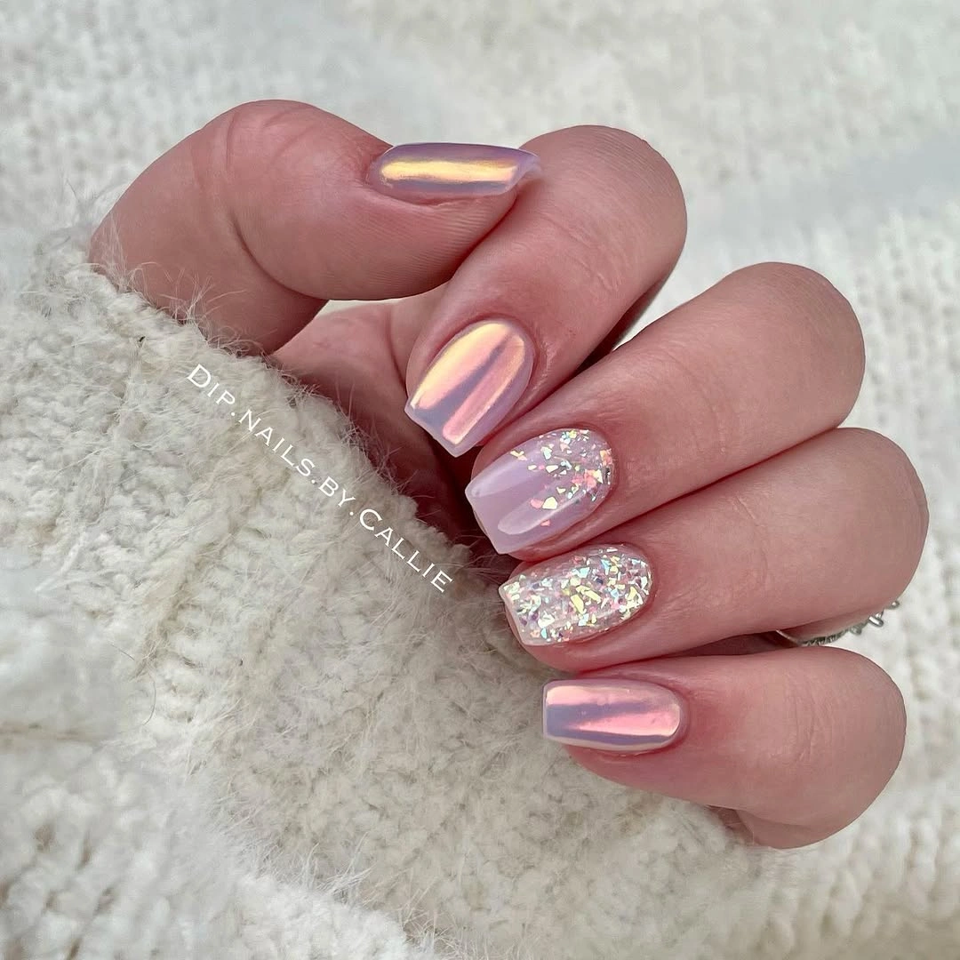 Short pink squoval nails with reflective and sparkly accents