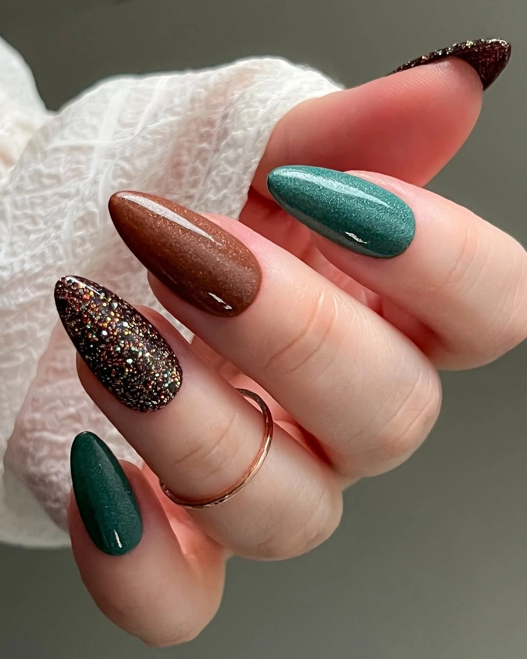 Long almond nails in chocolate brown emerald and dark glitter
