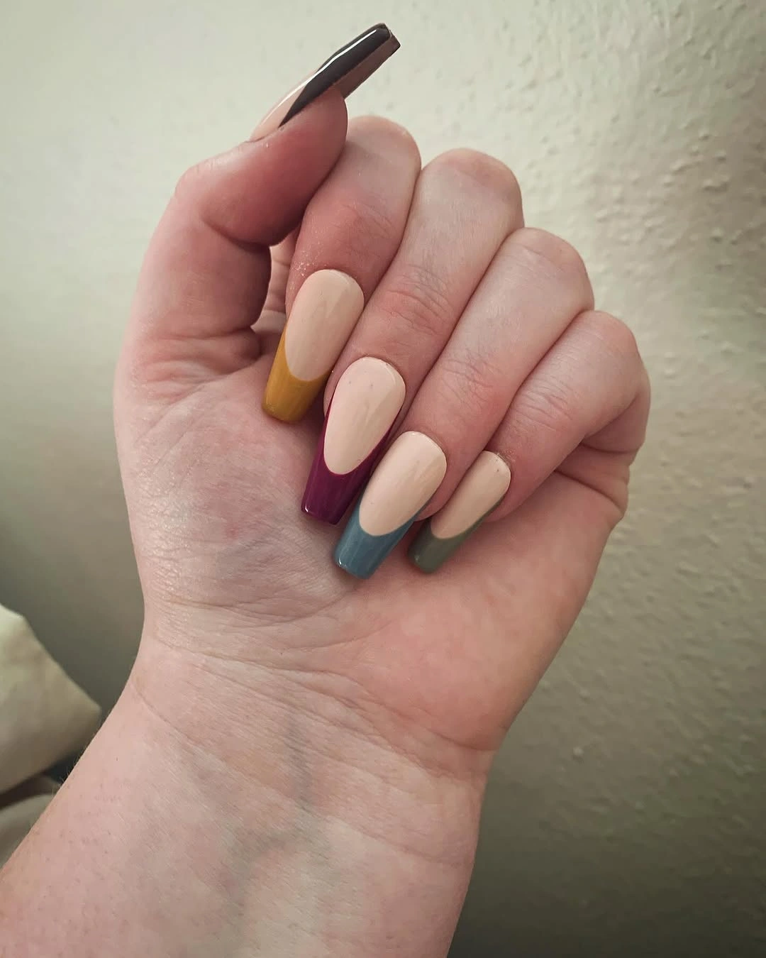 Medium almond nails with muted mustard burgundy plum gray and brown tips