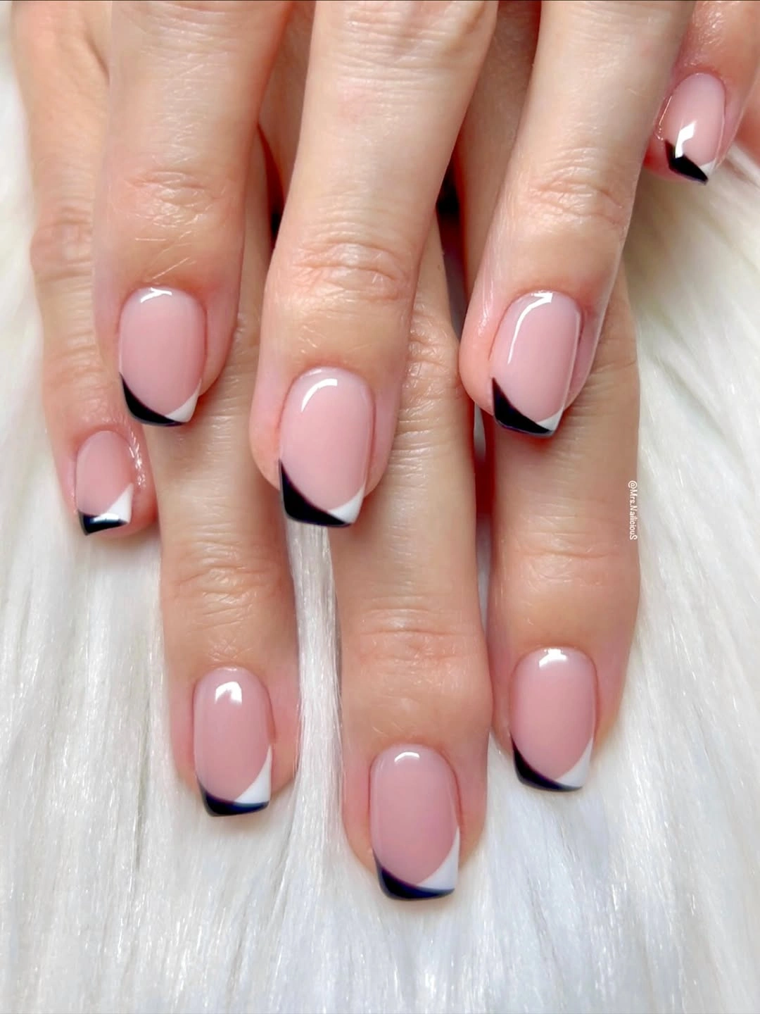 Short square pink nails with crisp black micro-French tips