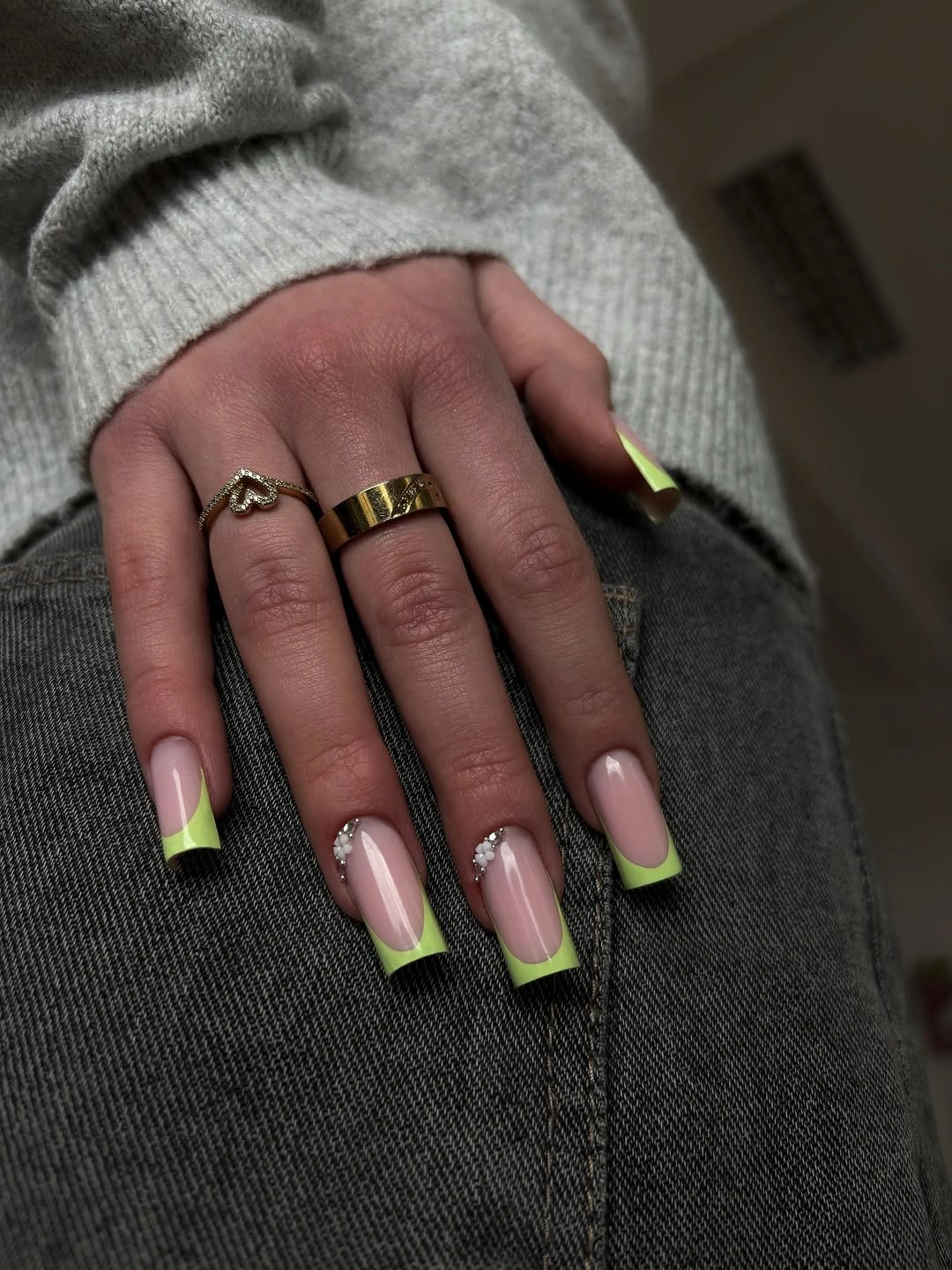 Long pale nails with chartreuse and olive green French tips