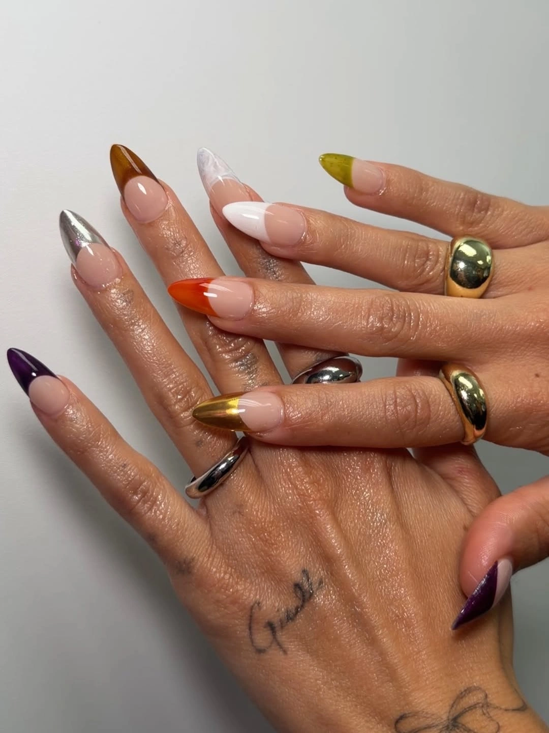 Long almond nails with purple brown olive orange and metallic tips