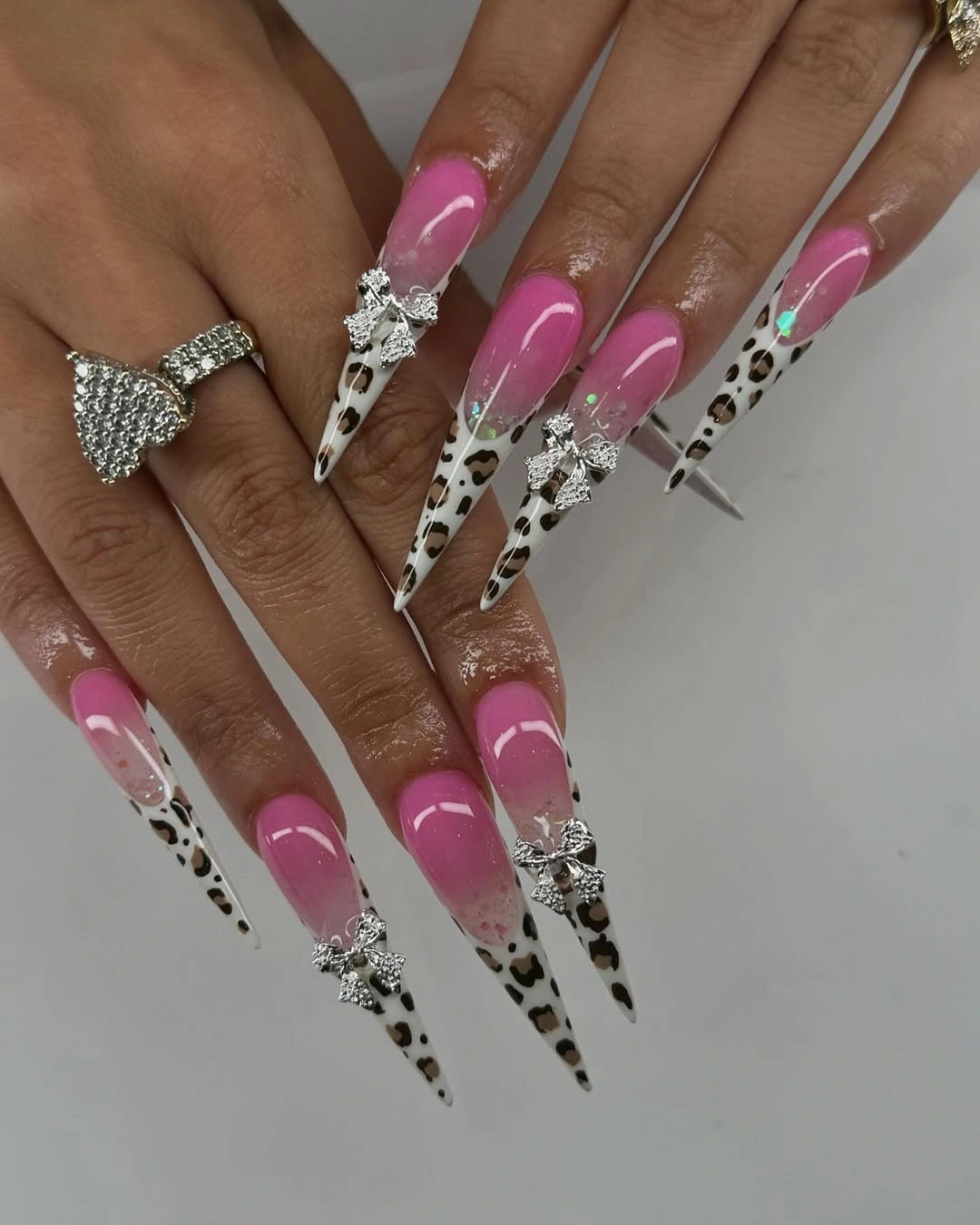 Pink stiletto nails with black and white spotted tip art