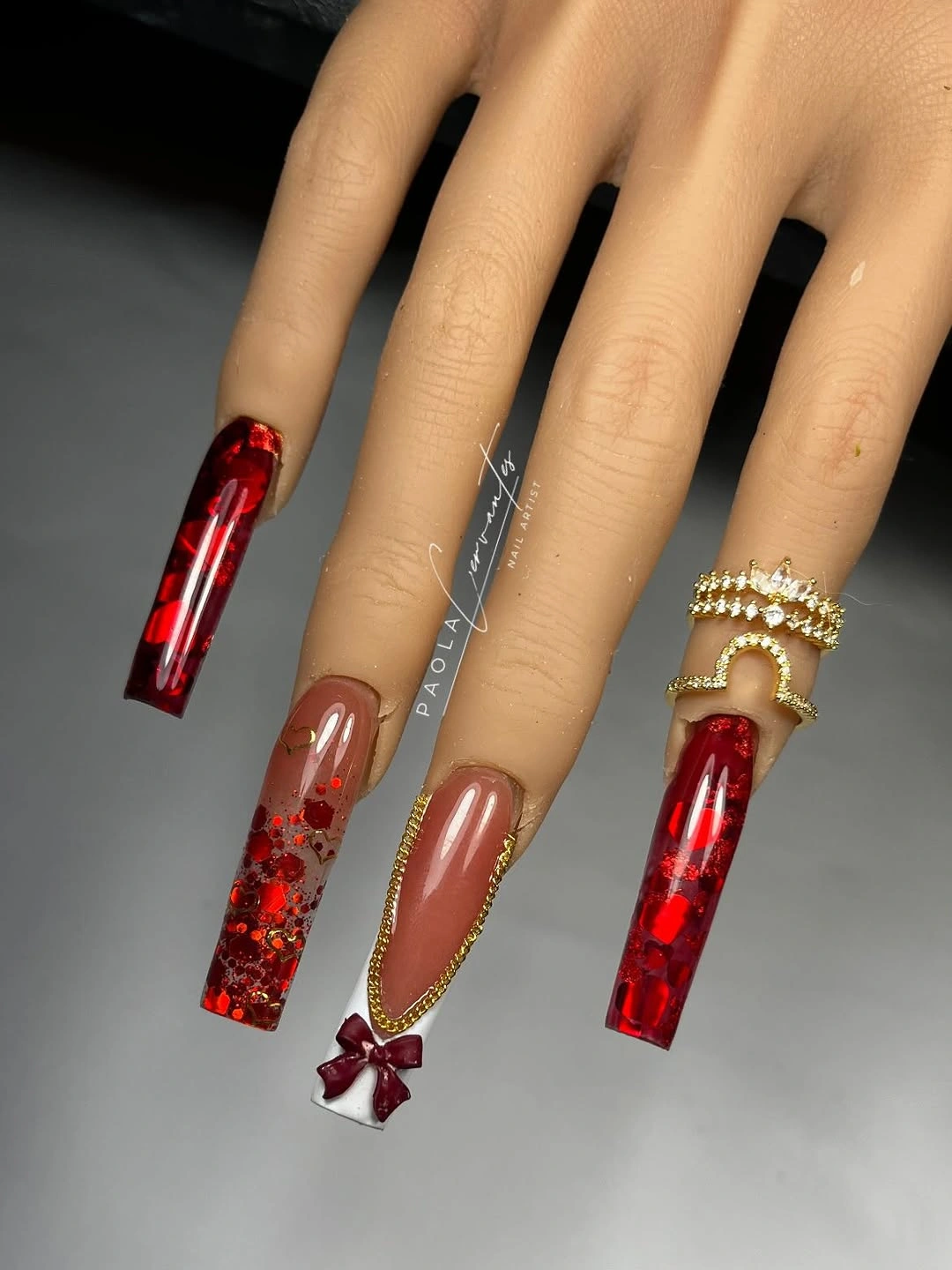 Brown and red chrome long coffin nails with a small butterfly accent