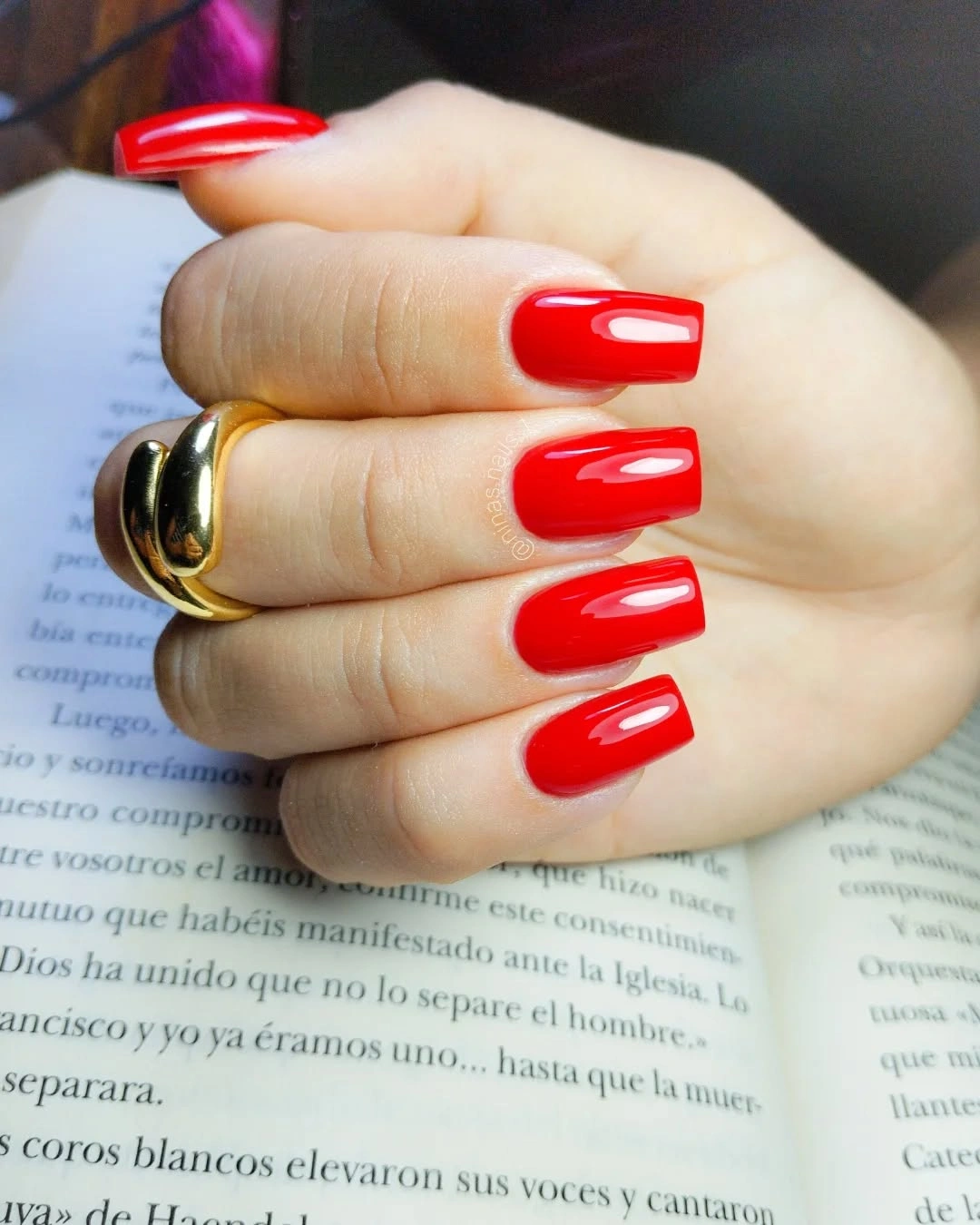 Glossy solid red long coffin nails in a saturated shade