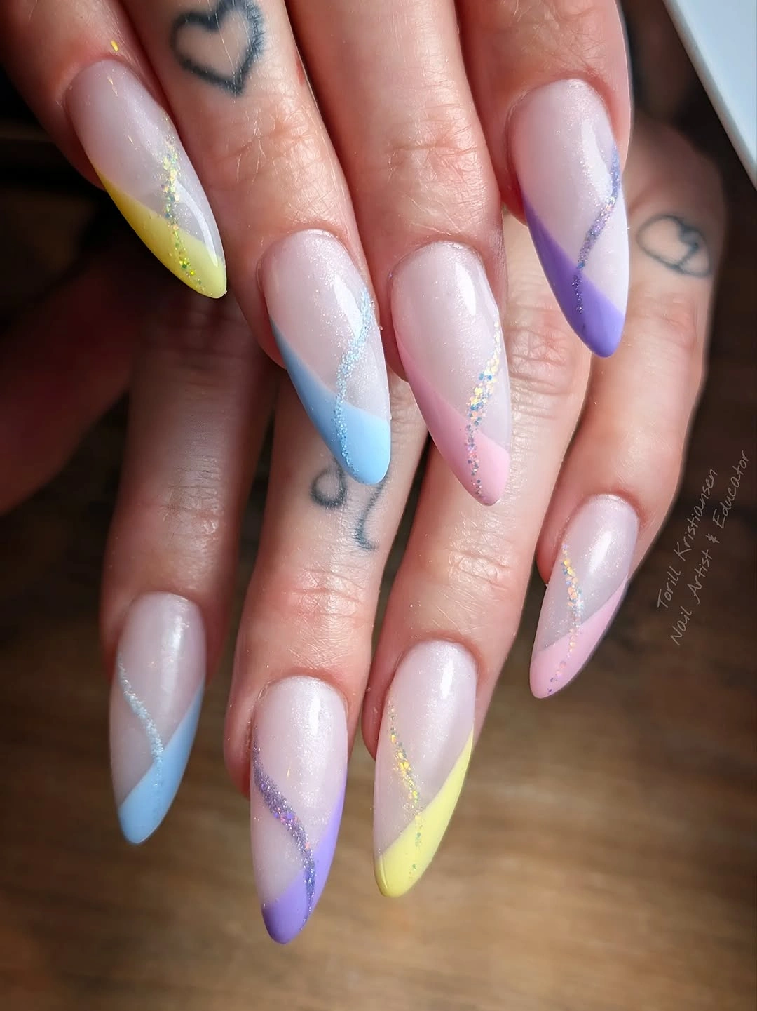 Long almond nails with pastel blue yellow lavender French tips