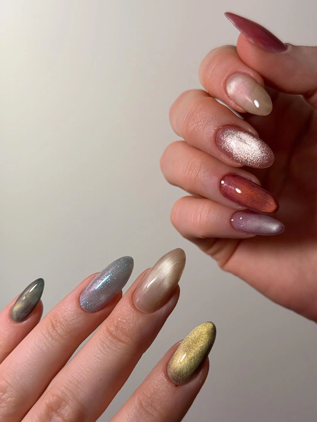 long almond nails with mauve brown red and metallic accents