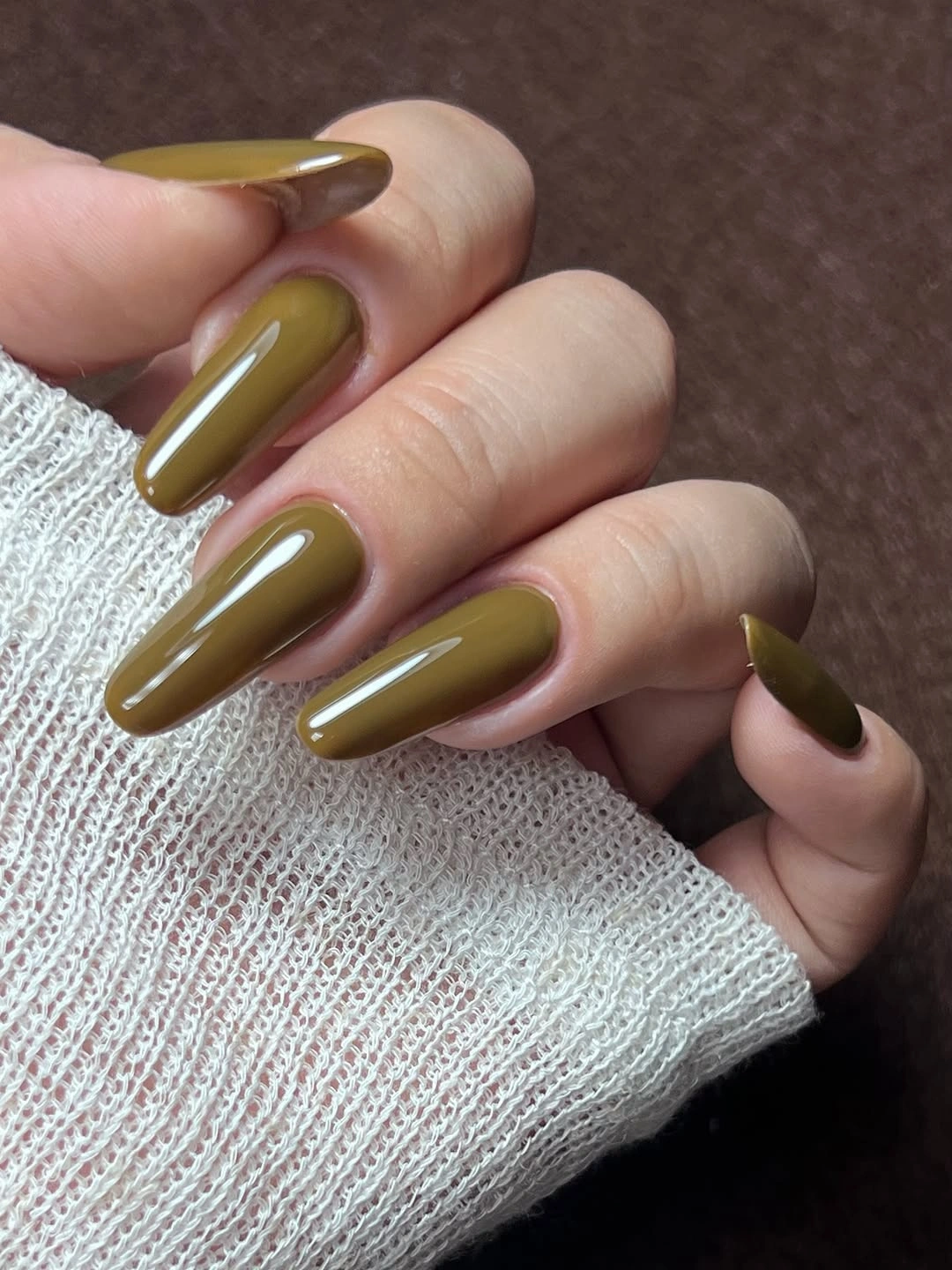 long almond nails in glossy olive khaki green