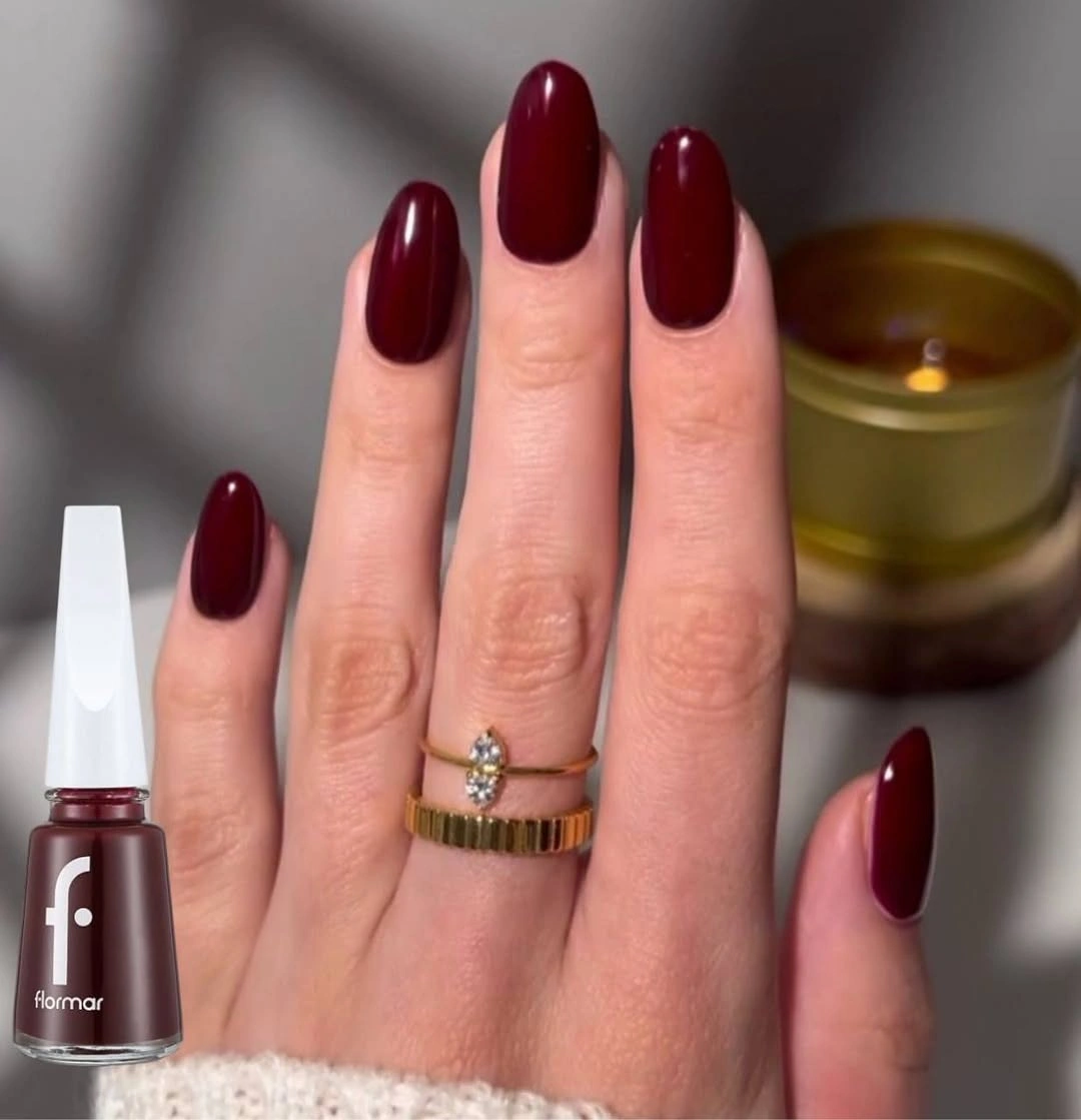 medium oval nails in glossy deep burgundy red
