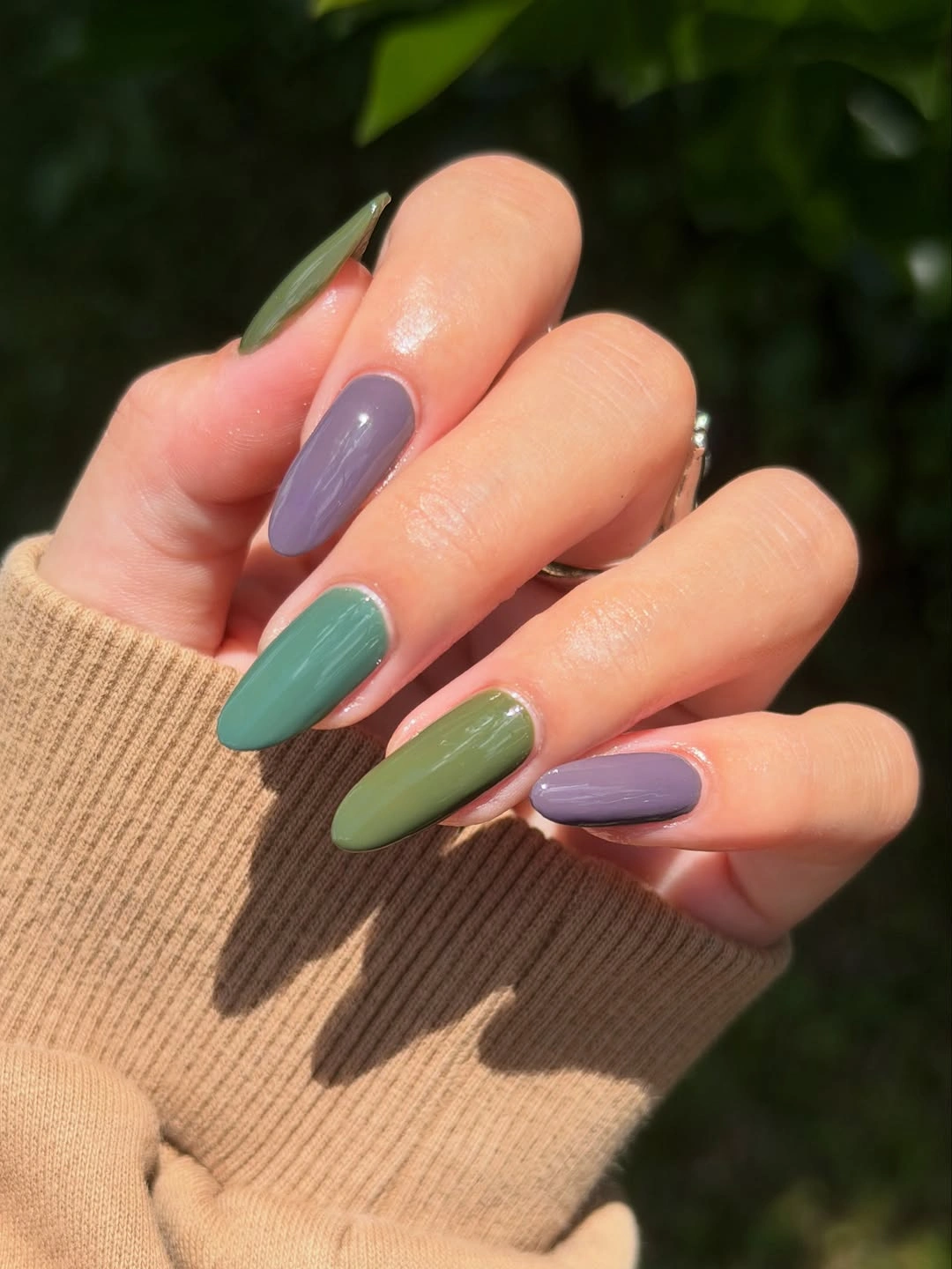 medium almond nails alternating sage green and lavender purple