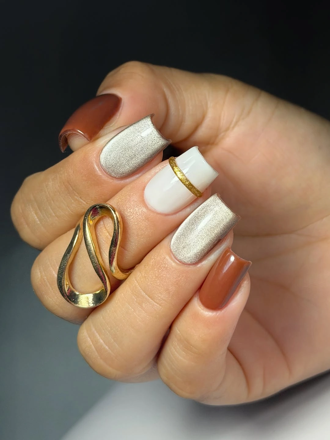 short square nails in cream brown and pale reflective neutrals