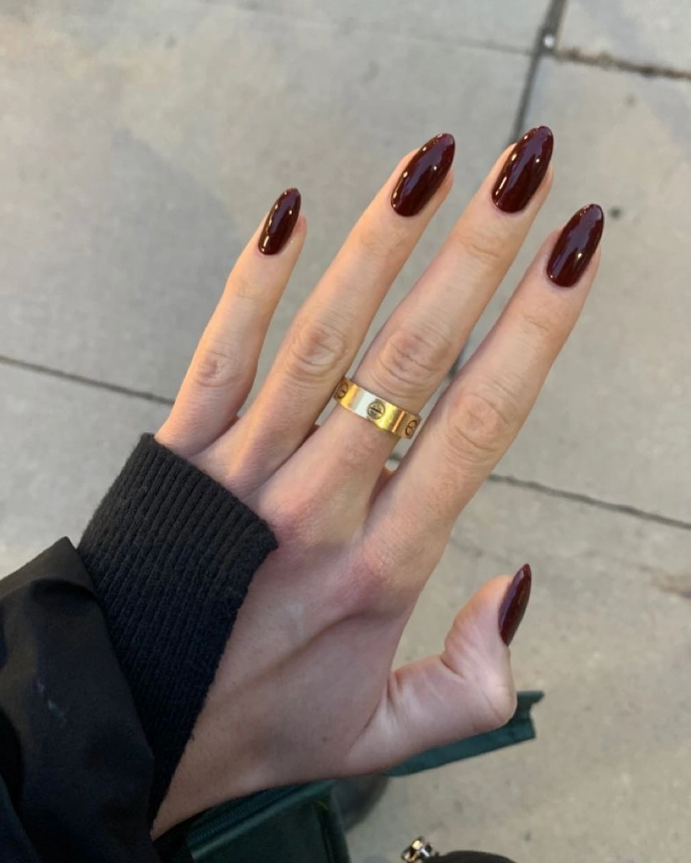 long almond nails in glossy burgundy plum
