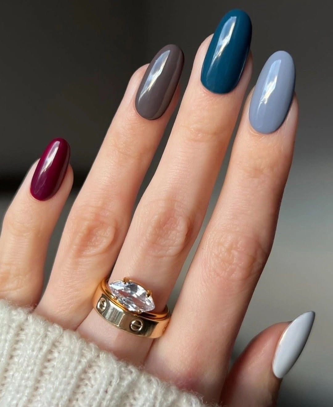 medium almond nails mixing burgundy teal charcoal and pale blue