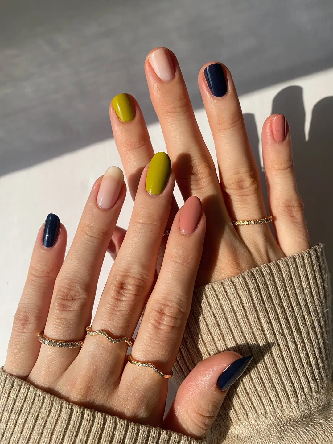 almond nails in navy mustard coral pink and olive tones