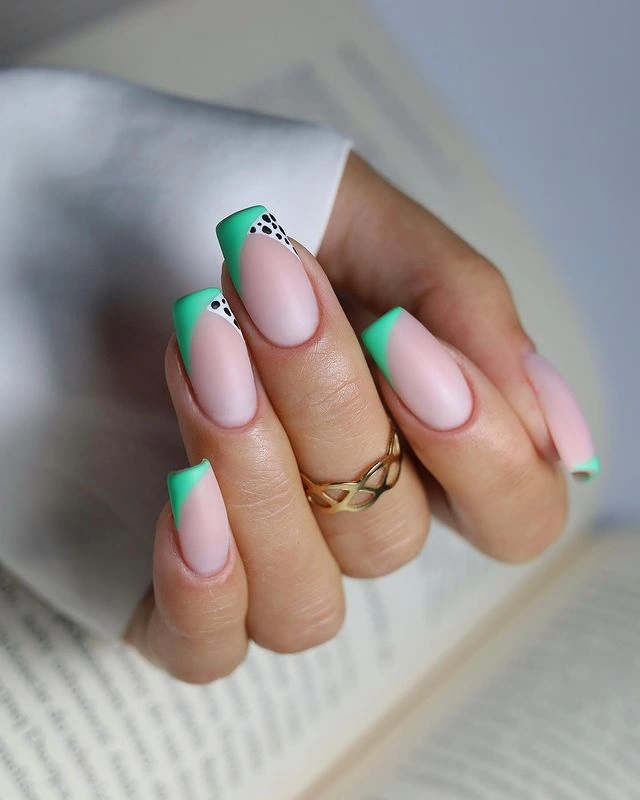 Long almond nails with sheer blush base and mint French tips