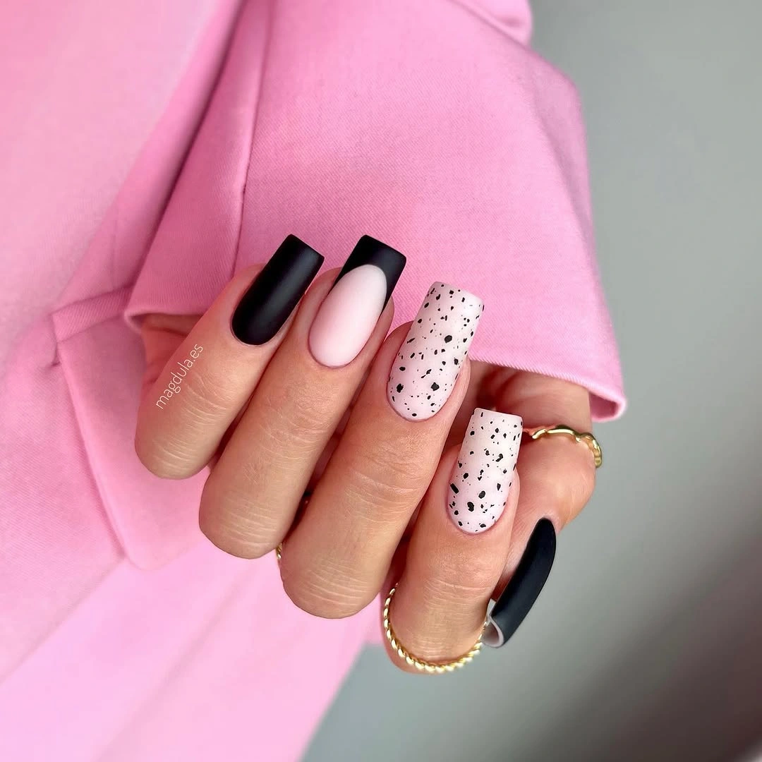 Short square nails with black blocks and dotted pale accents