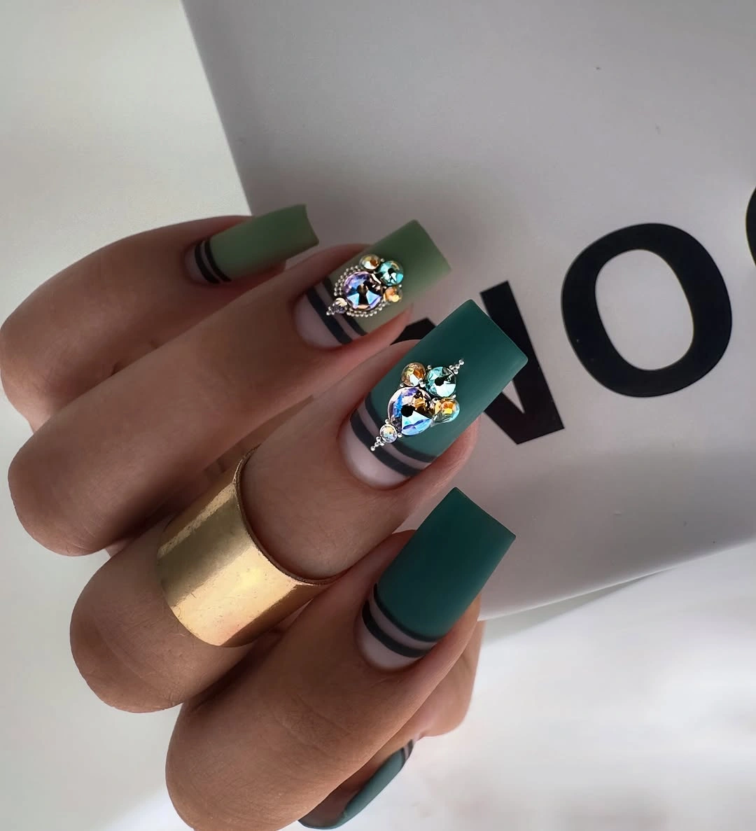 Long coffin dark teal nails with iridescent accent clusters