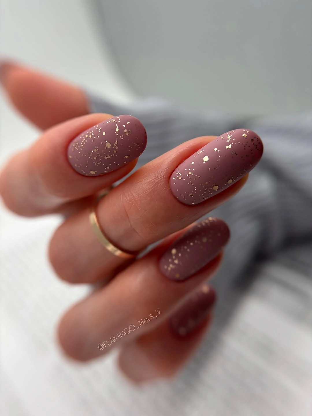 Medium almond mauve nails with fine pale surface specks