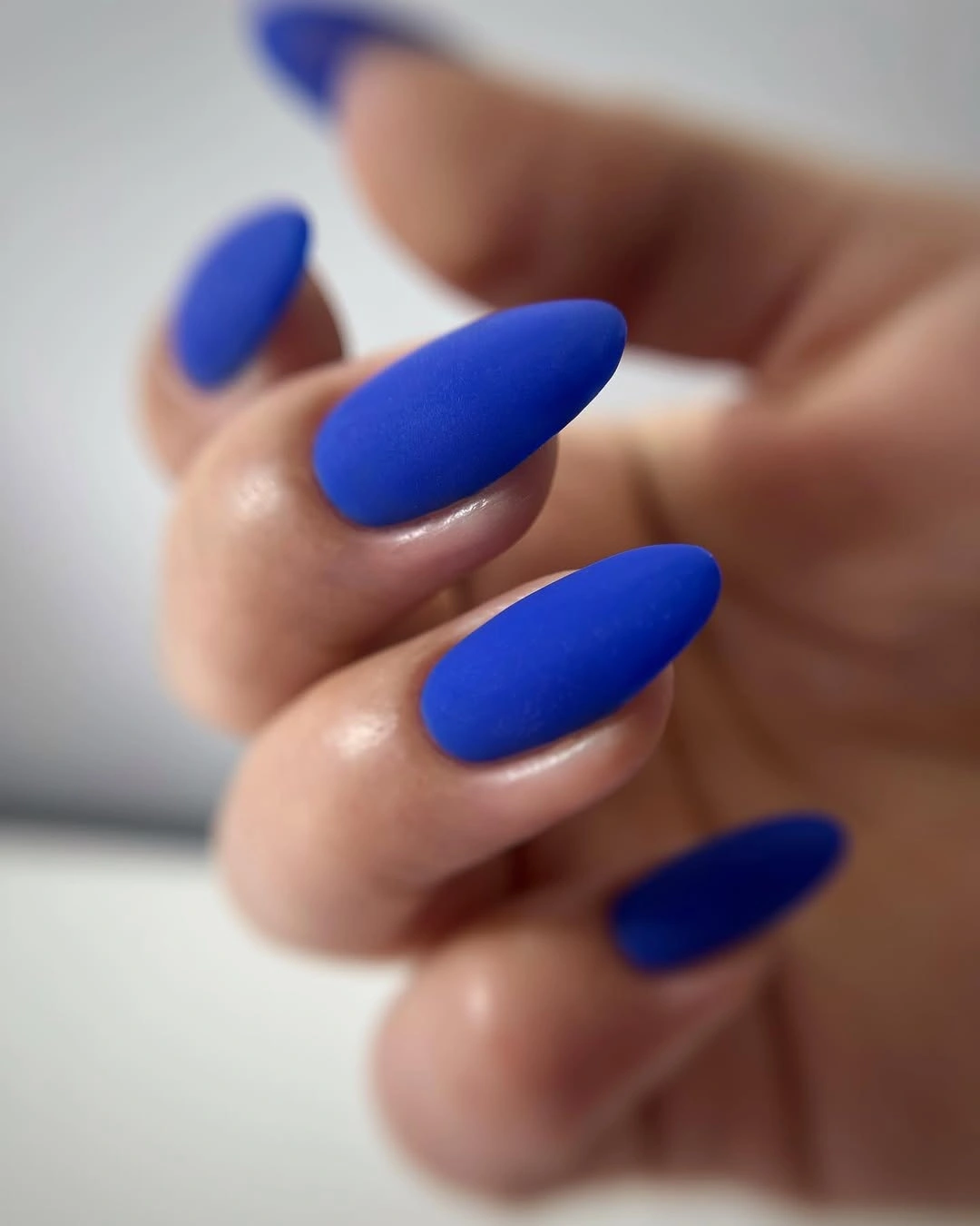 Medium coffin cobalt nails with one deep blue sparkling accent