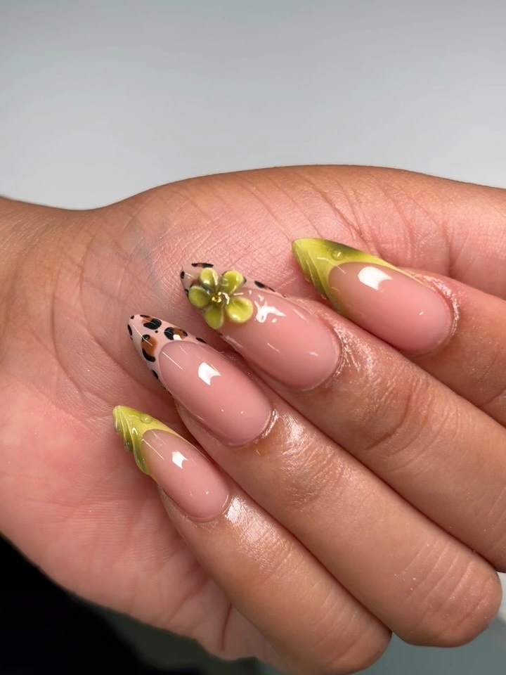pink almond nails with lime tips, leopard accent, and yellow flower