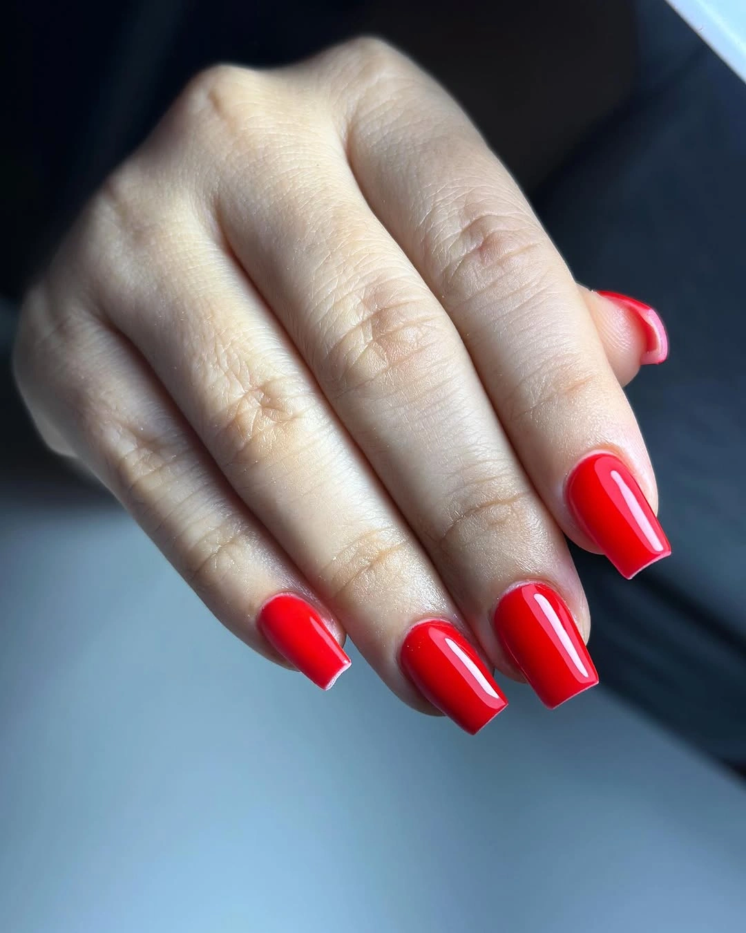 glossy medium-length square nails in bright red