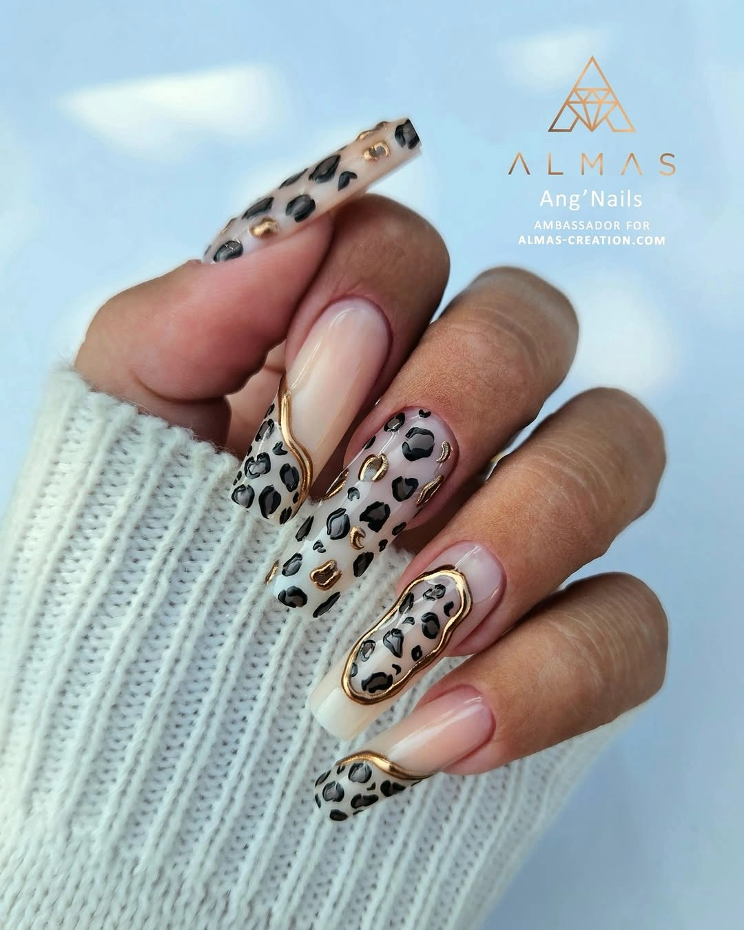 Milky square nails with leopard spots and gold curves