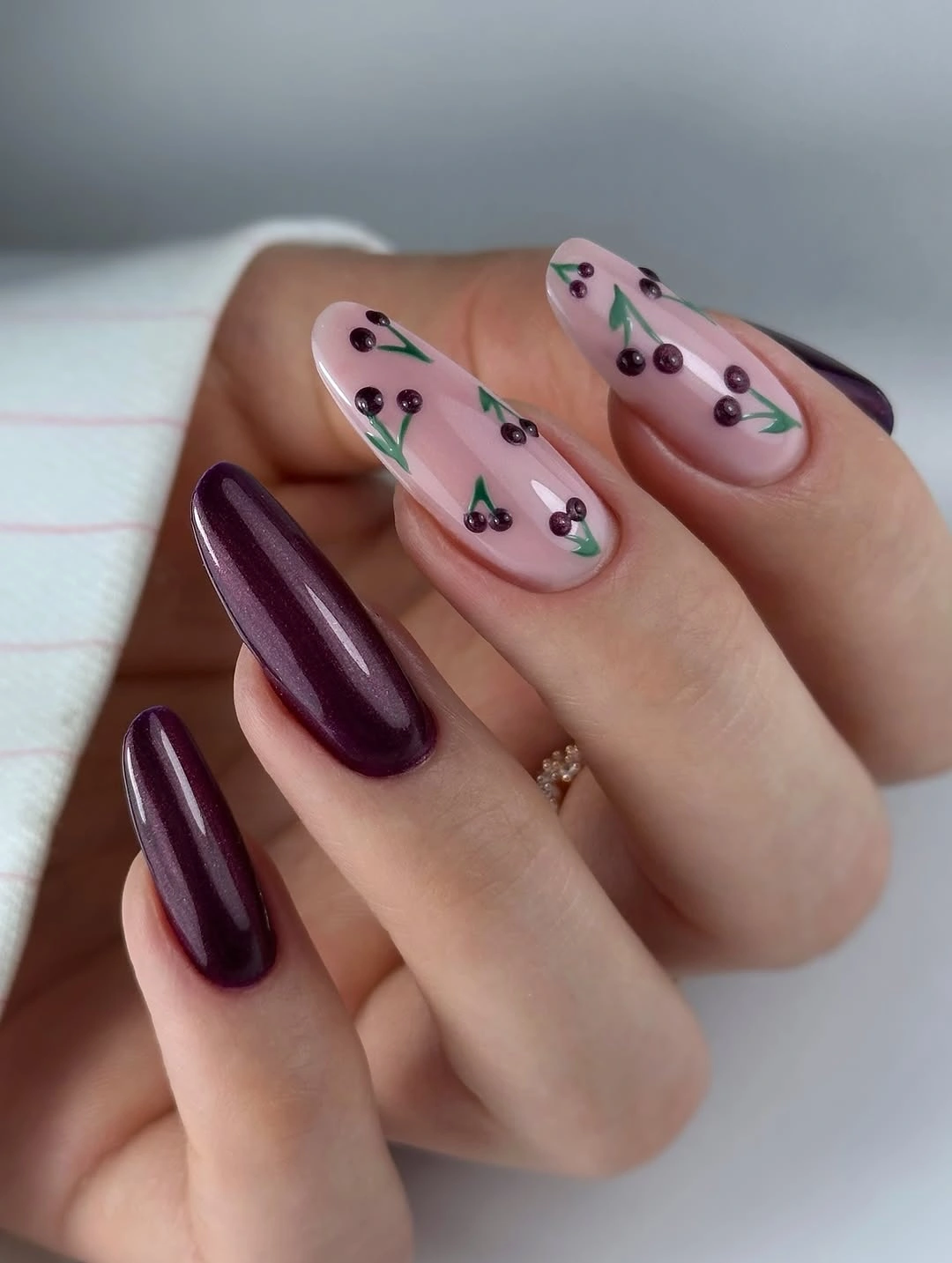 Plum nails with sheer berry branch accent designs