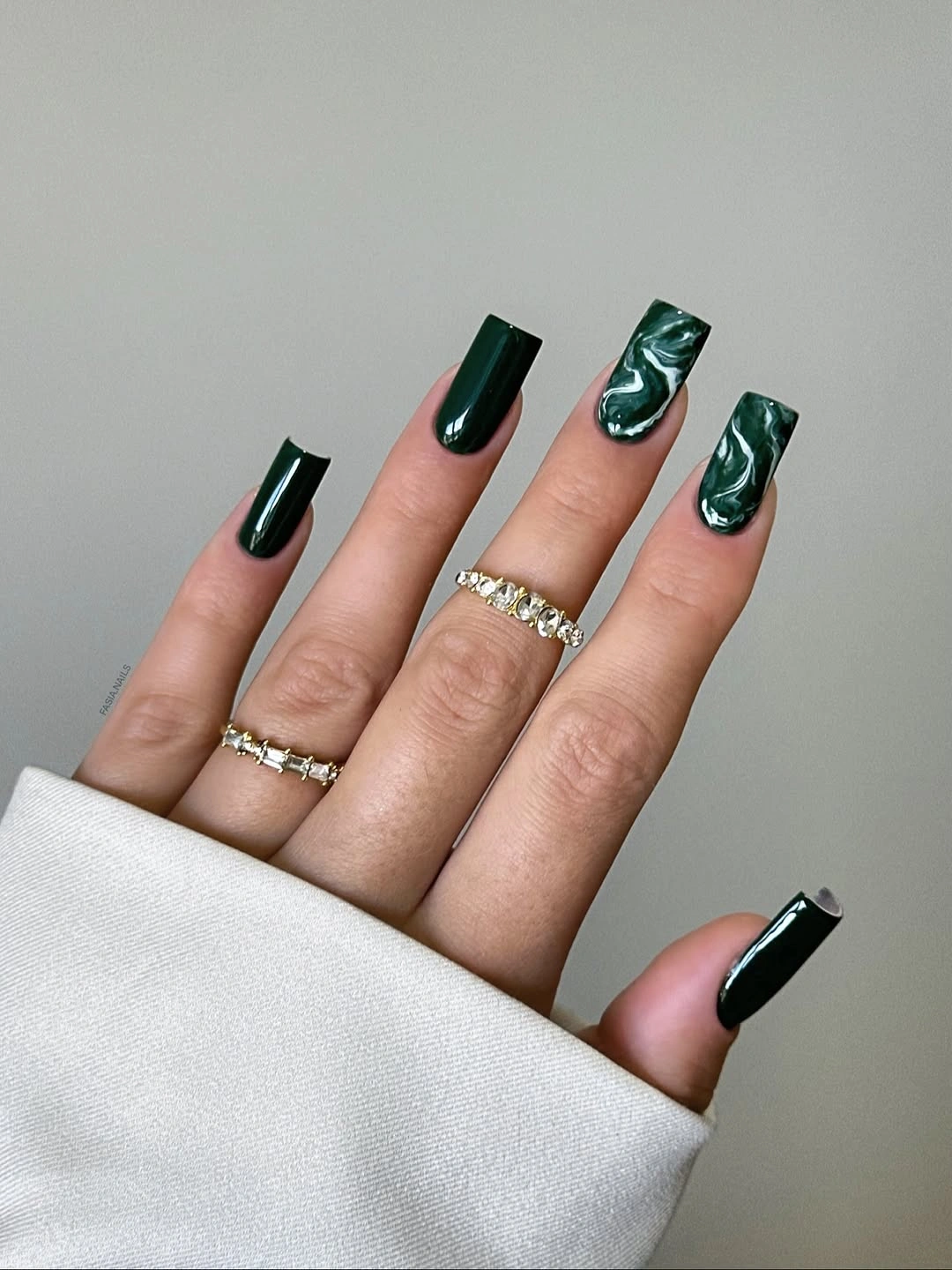 Dark green square nails with green-white marble accents