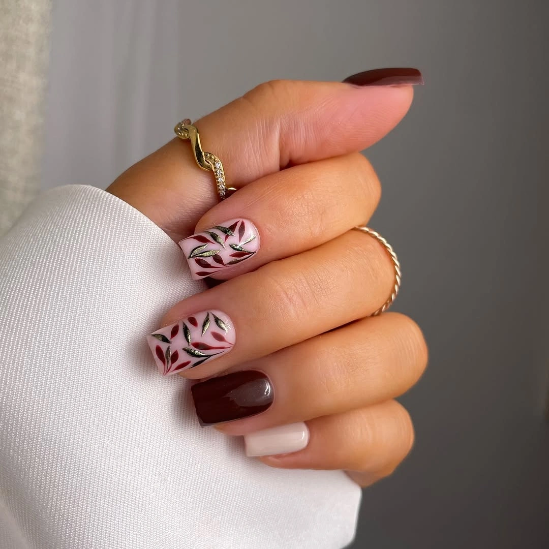 Brown square nails with pink leaf accent designs