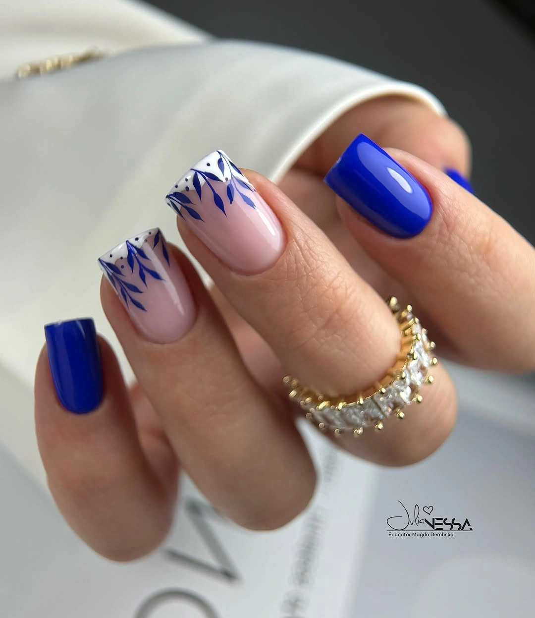 Cobalt square nails with leafy white French tips