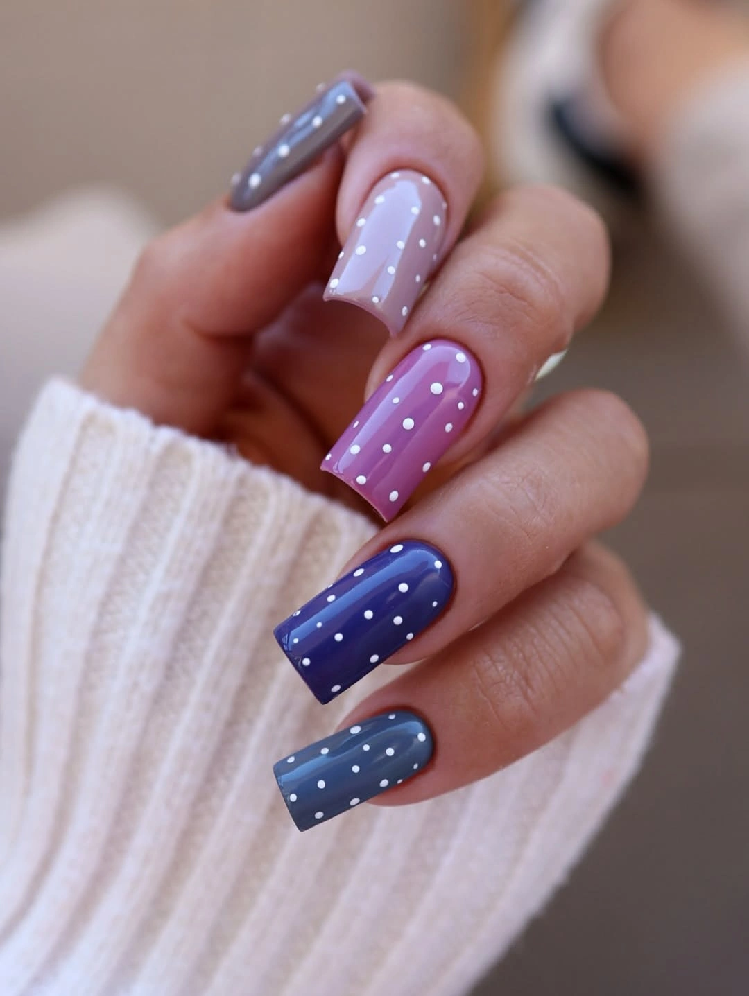 Muted square nails with multicolor bases and white dots