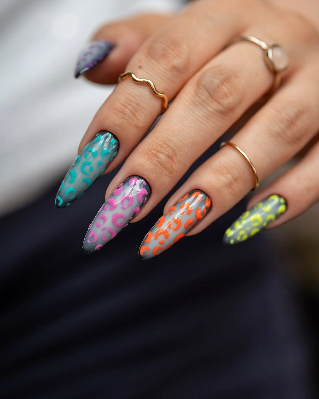 Smoky gray almond nails with neon animal print spots