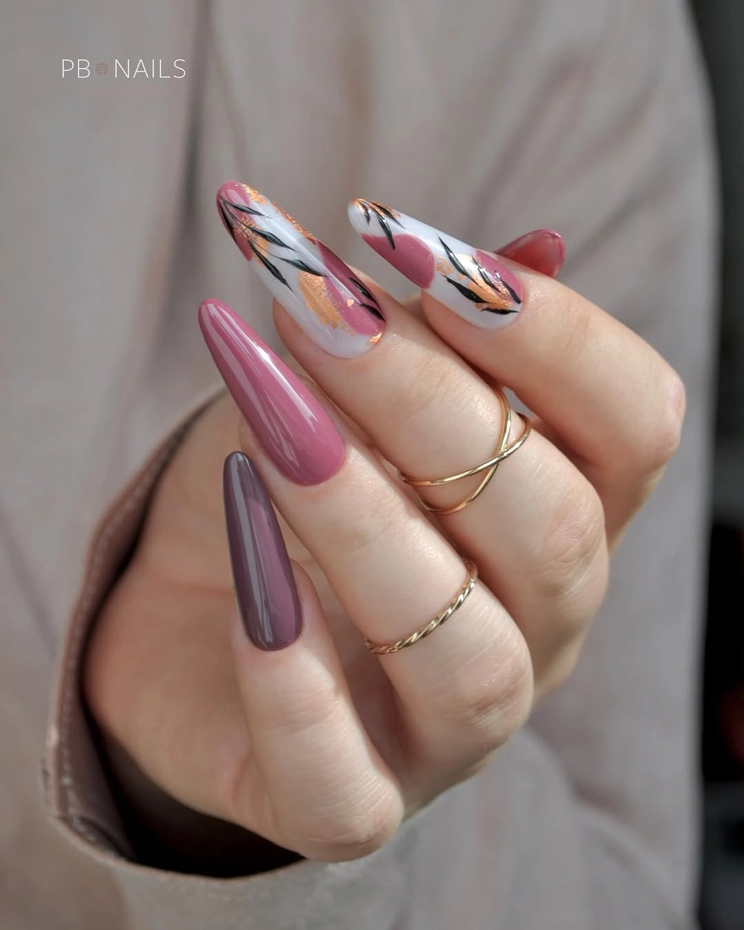 Mauve nails with white botanical accent designs