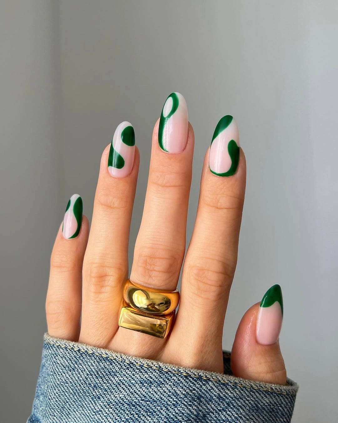 Medium almond nails with deep green French edges and pink centers