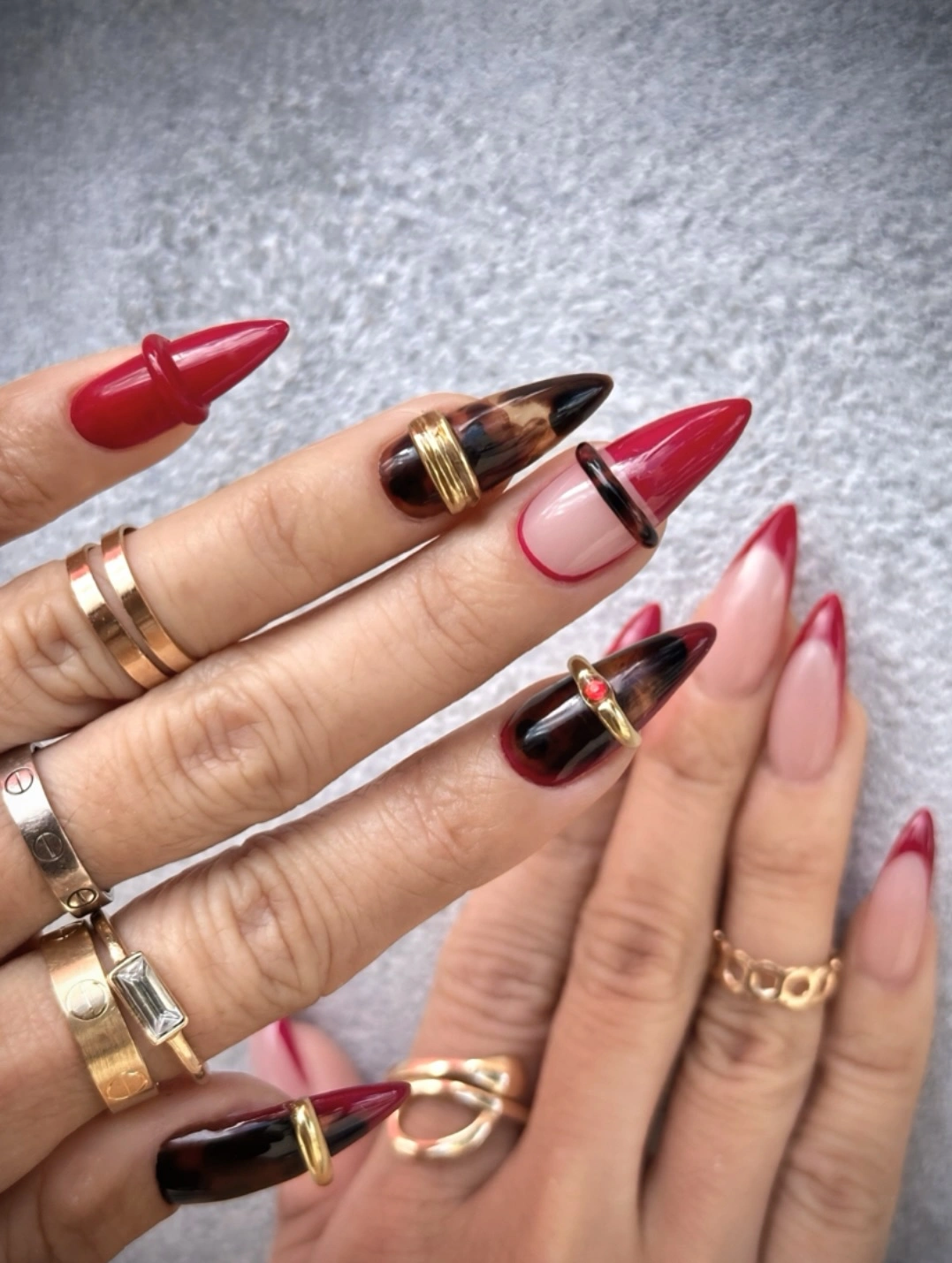 Long pointed nails with red black nude white and gold geometry