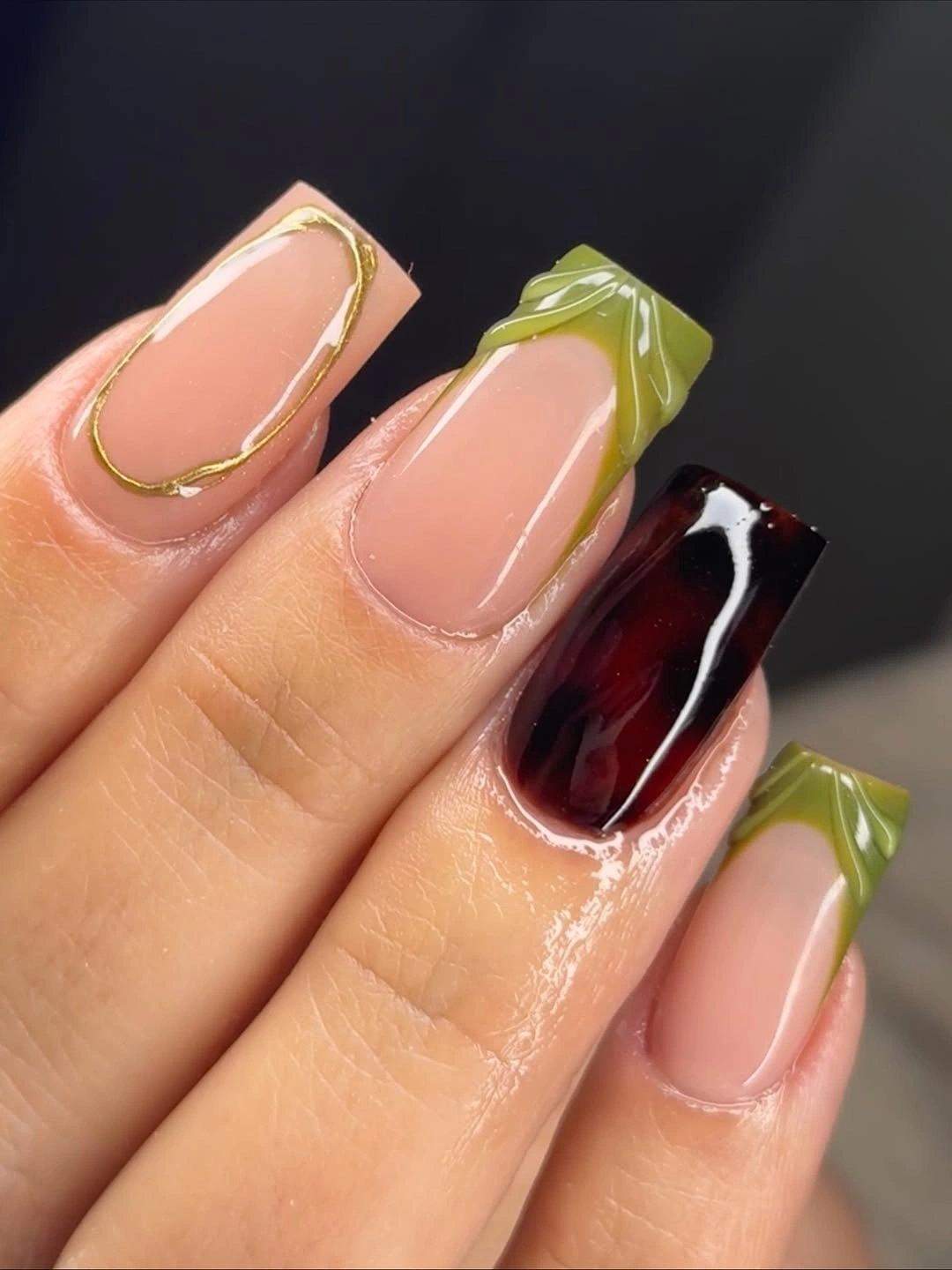 Olive square nails with tortoiseshell accent and gold outline
