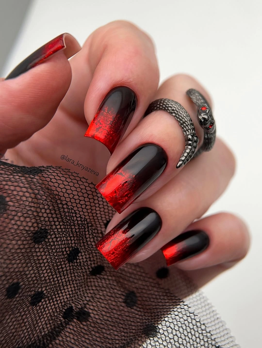 Black square nails with red metallic-looking ends