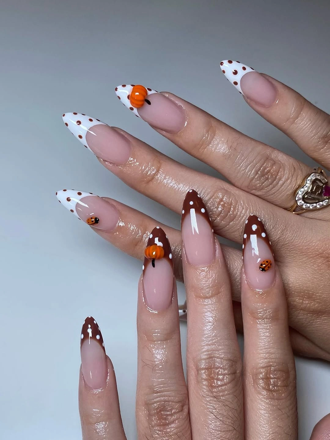 Pumpkin polka-dot French tips on almond nails