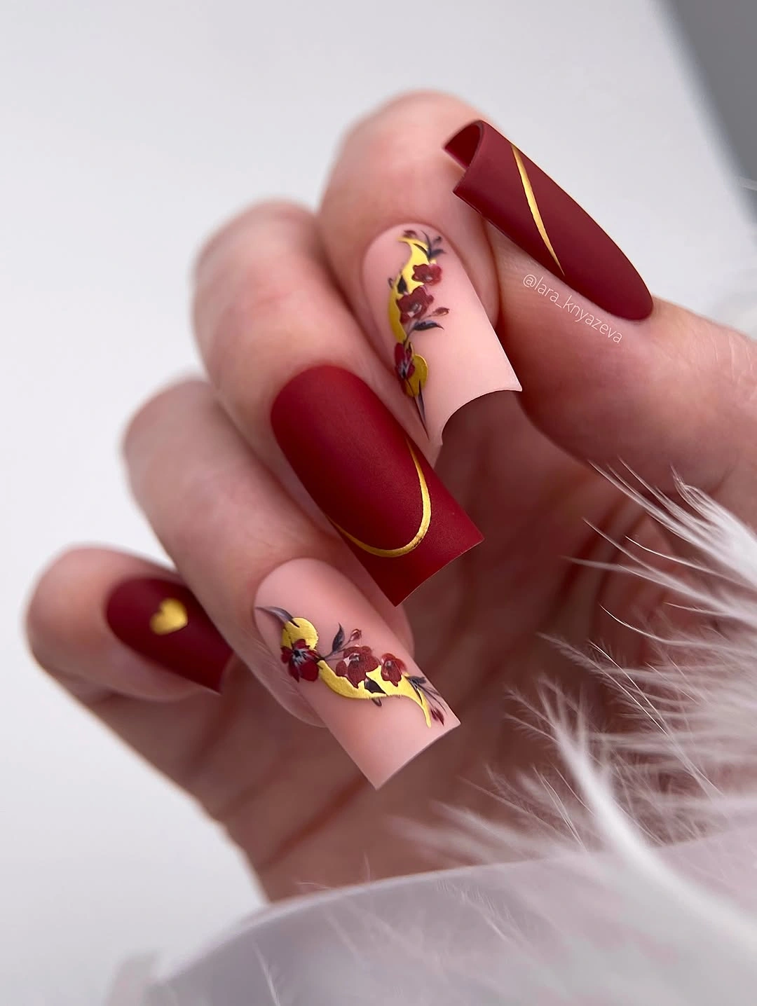 Matte burgundy square nails with blush floral accents