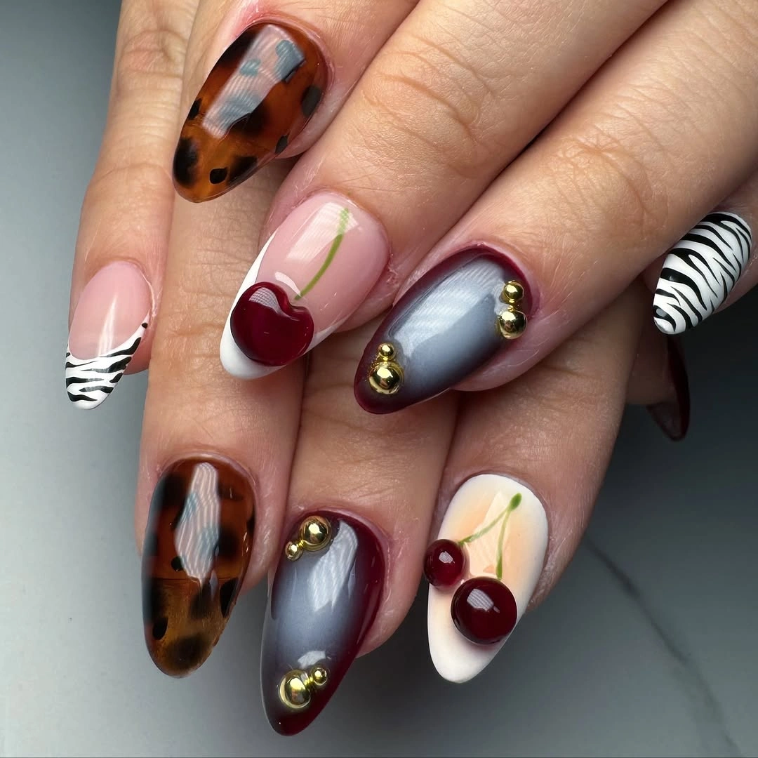 Mixed almond fall nails with spots stripes and burgundy