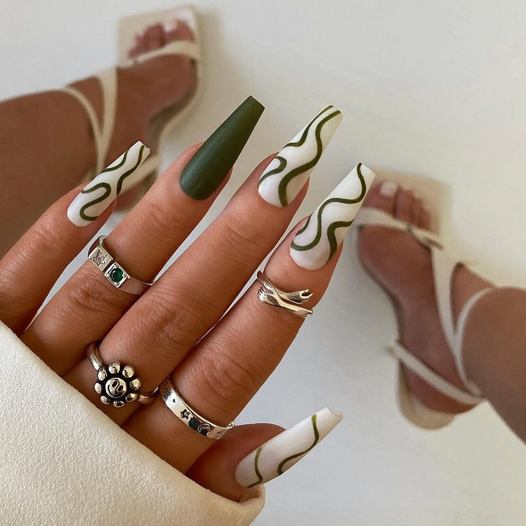 White square nails with olive green wavy lines