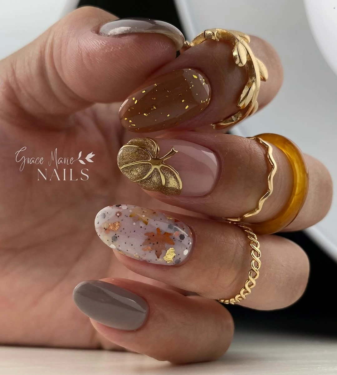 Neutral fall nails with caramel taupe and gold leaf detail