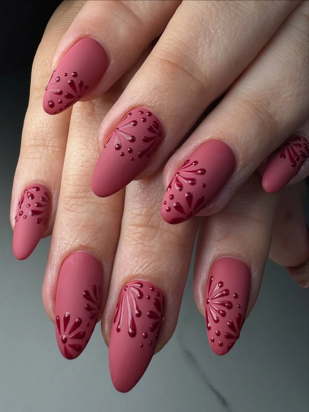 Dusty rose almond nails with tonal floral branch details