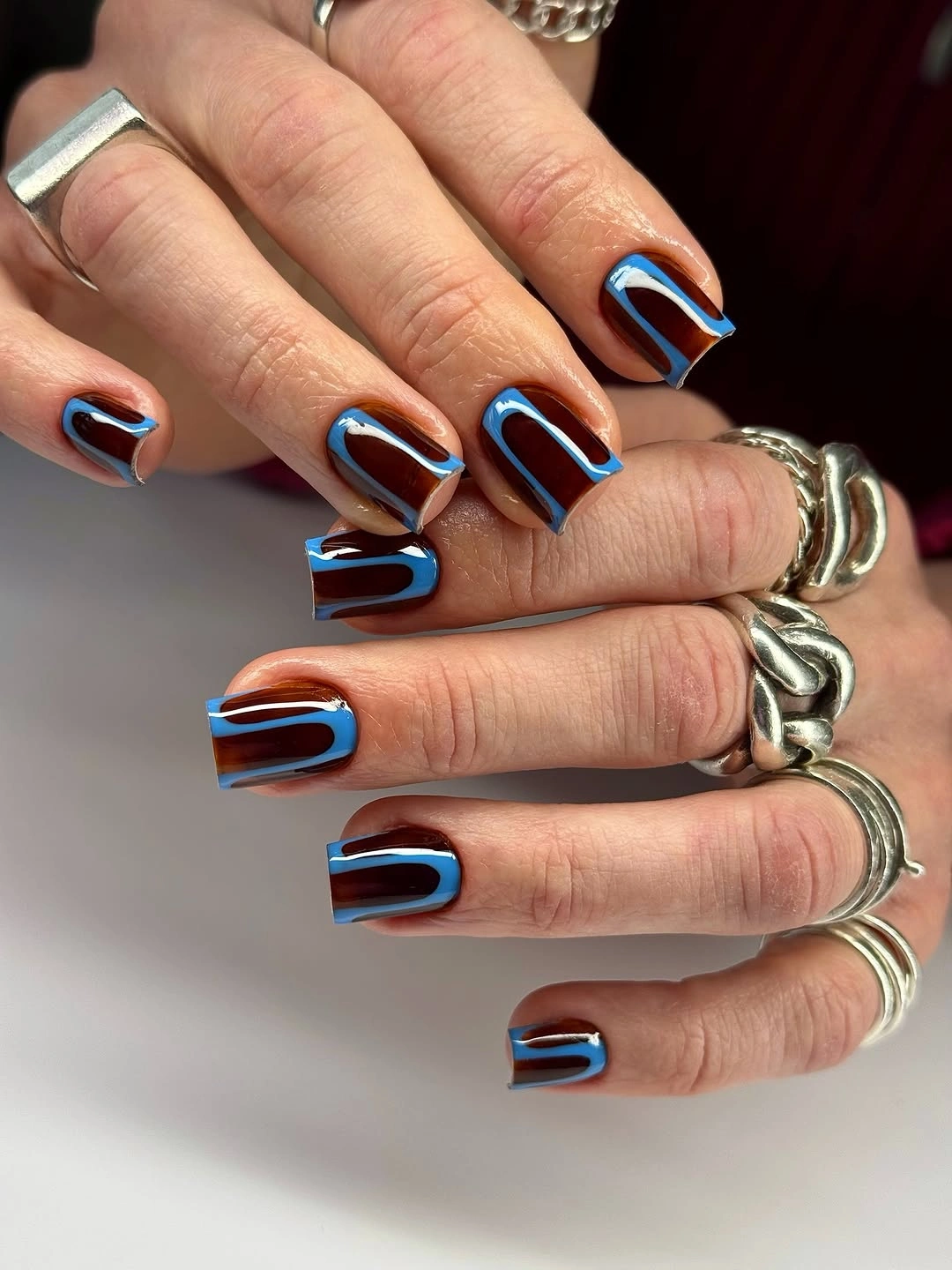 Medium coffin square nails with bright blue red and white curved arcs