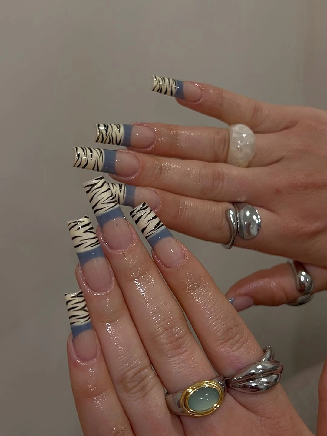 Long square lavender and white nails with black striped tips