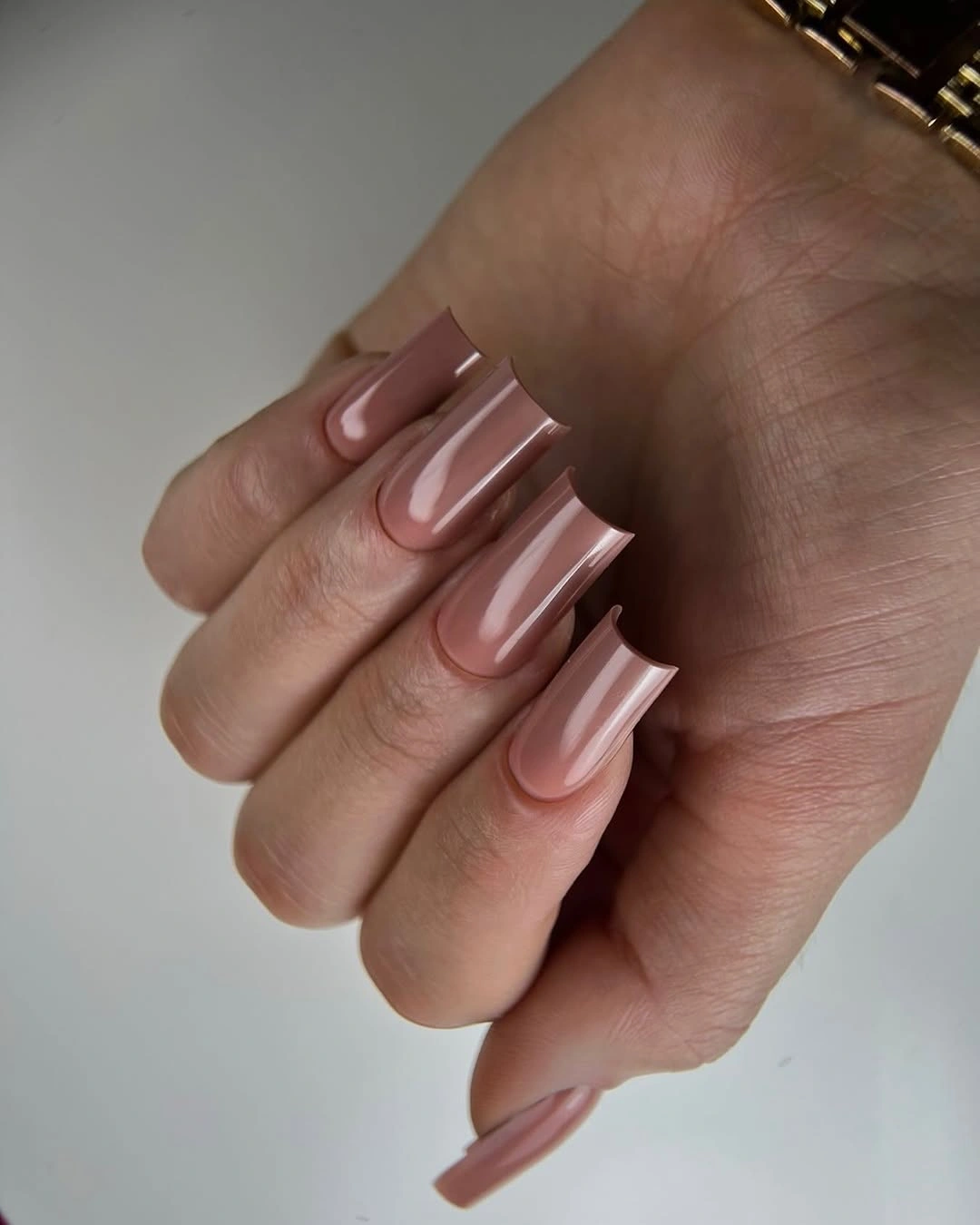 Long square nails in glossy reflective dusty rose